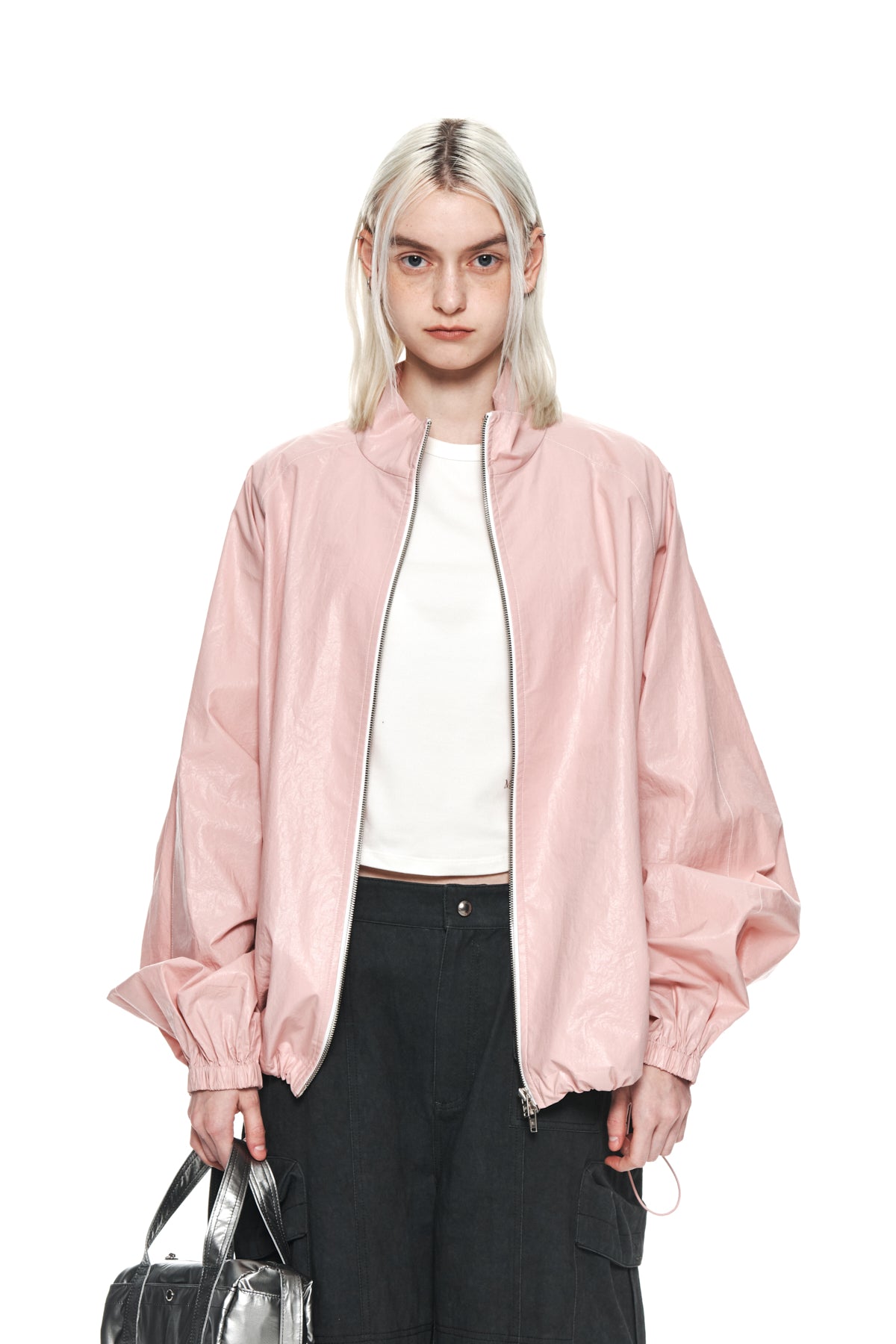 Áo khoác nữ oversize màu hồng với logo Matin Kim, có tay rộng và túi bên.