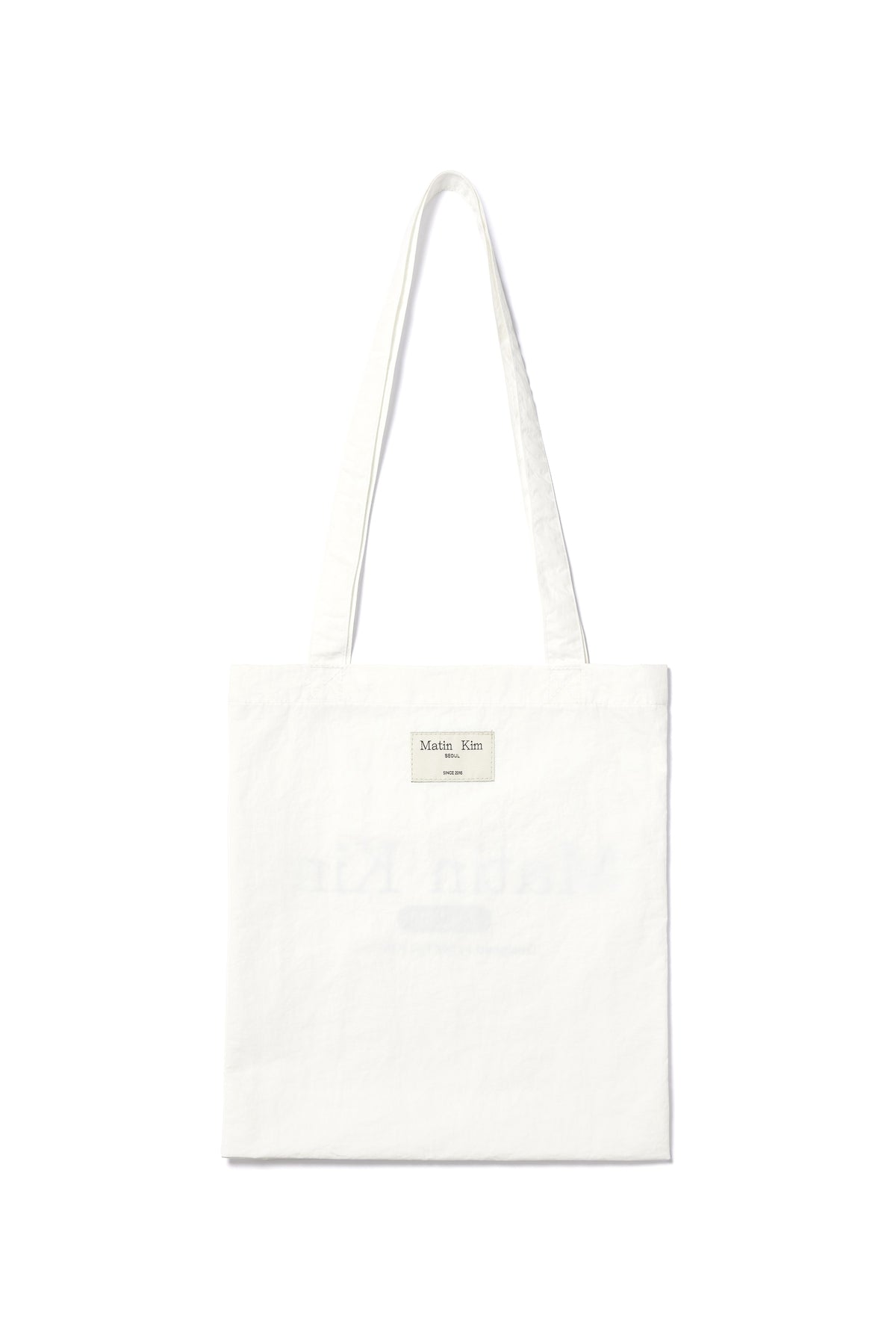 Túi tote unisex với họa tiết chữ in, màu trắng, thiết kế hiện đại.