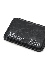 Phụ kiện unisex với thiết kế tối giản và logo Matin Kim nổi bật.