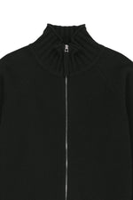 Áo khoác nữ với thiết kế cropped, dệt kim và khóa kéo, tay ôm gọn.