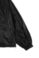 Áo khoác nữ oversize với logo Matin Kim, cổ áo thẳng, tay dài và thiết kế tinh tế.