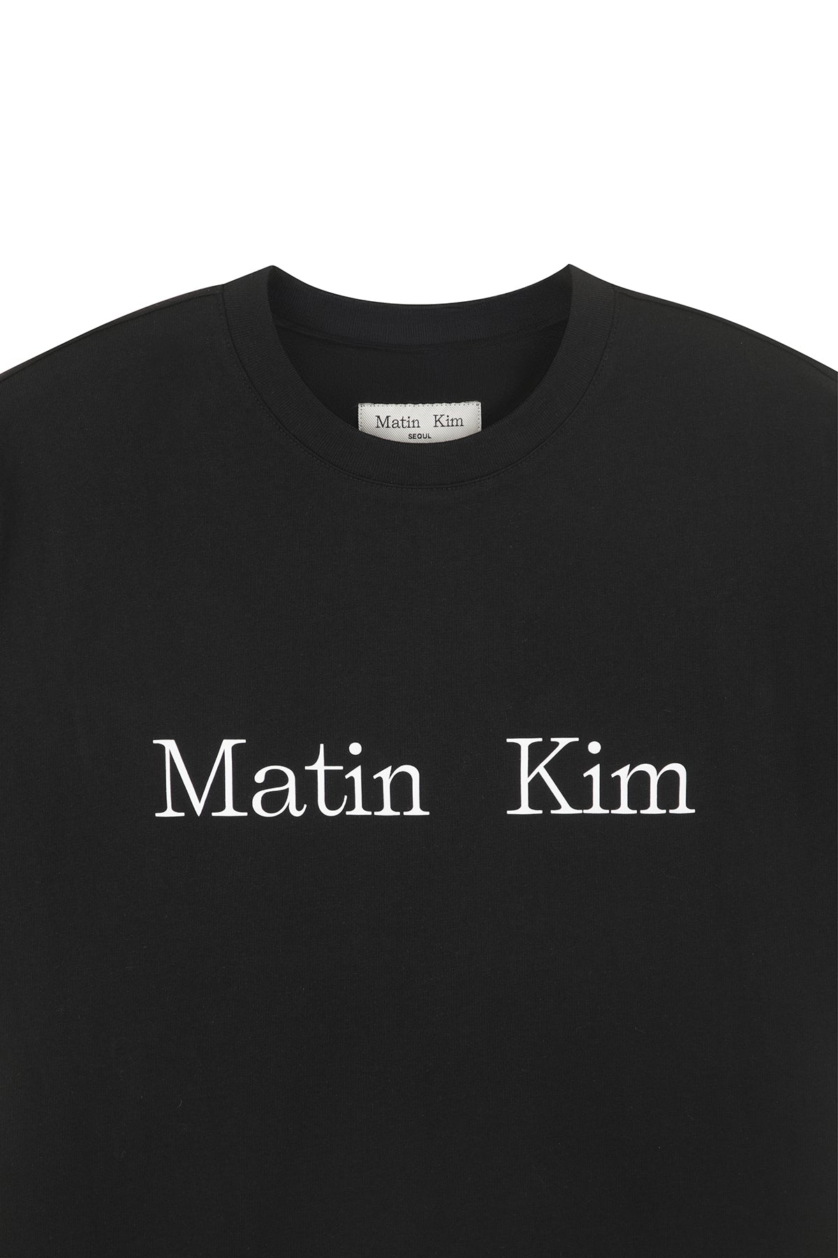 Áo unisex với thiết kế cổ tròn, tay ráp, và logo Matin Kim in lụa ngang ngực.