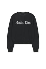 Áo khoác nữ với chi tiết logo Matin Kim, thiết kế hiện đại, cổ tròn, tay dài ôm và gấu bo viền.