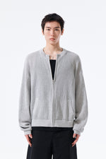 Áo len unisex với thiết kế dệt kim và logo Matin Kim nổi bật.