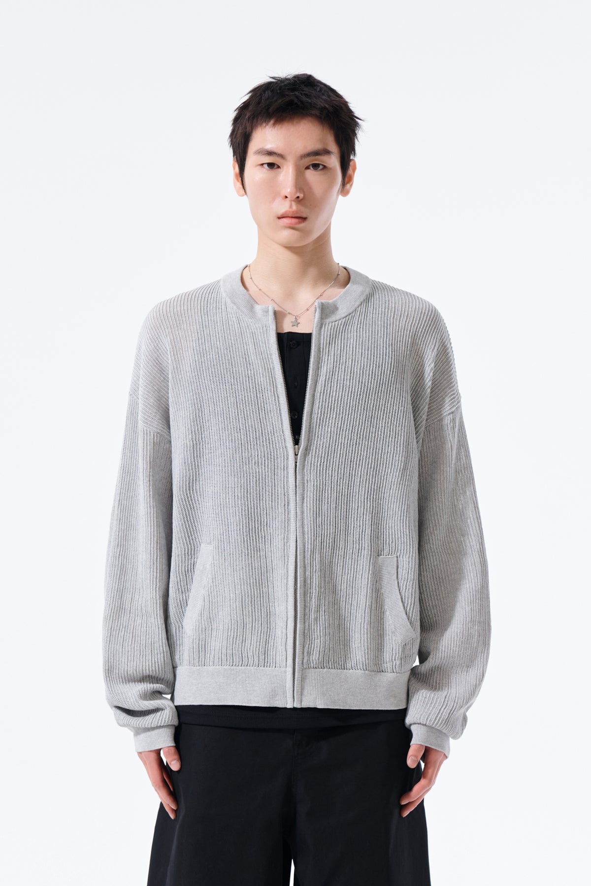 Áo len unisex với thiết kế dệt kim và logo Matin Kim nổi bật.