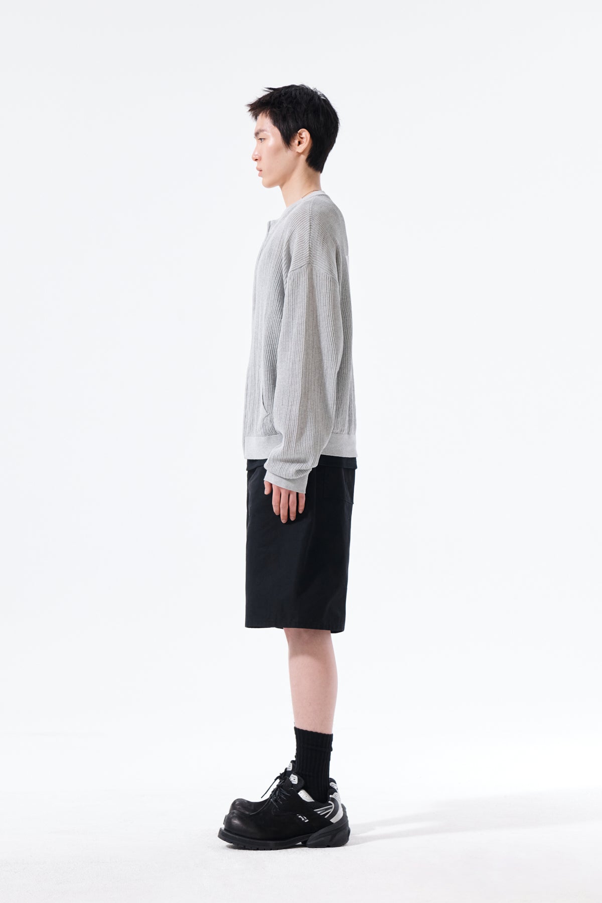 Áo len unisex với thiết kế dệt kim và logo Matin Kim nổi bật.