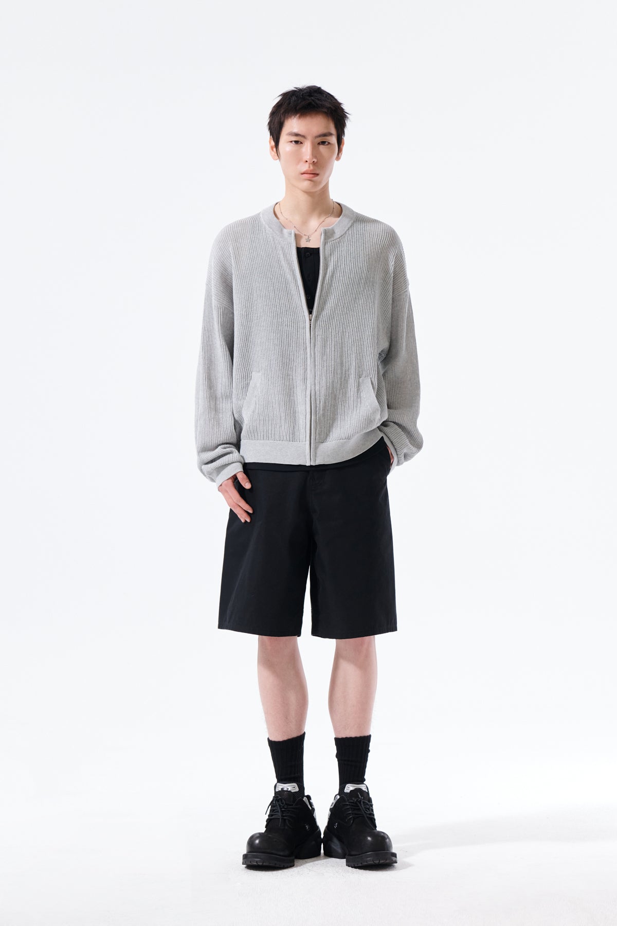 Áo len unisex với thiết kế dệt kim và logo Matin Kim nổi bật.