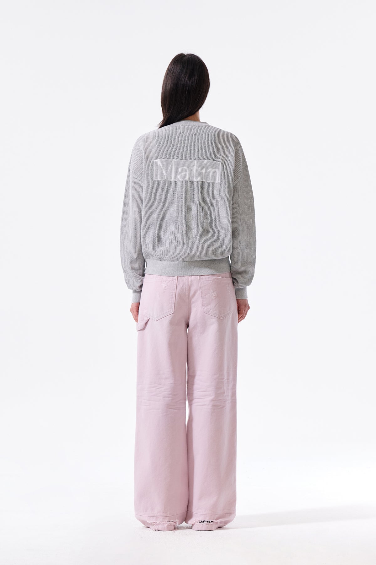 Áo len unisex với thiết kế dệt kim và logo Matin Kim nổi bật.