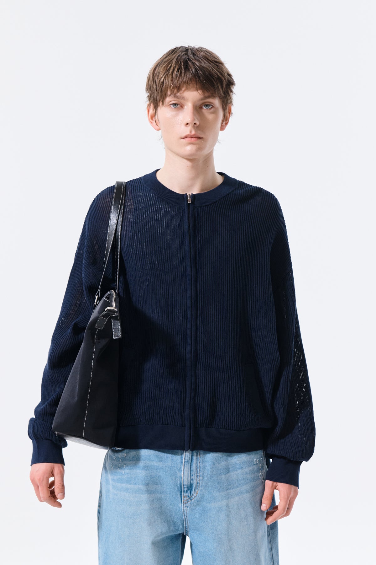 Áo len unisex với thiết kế thoáng khí, có túi trước và logo Matin Kim nổi bật.