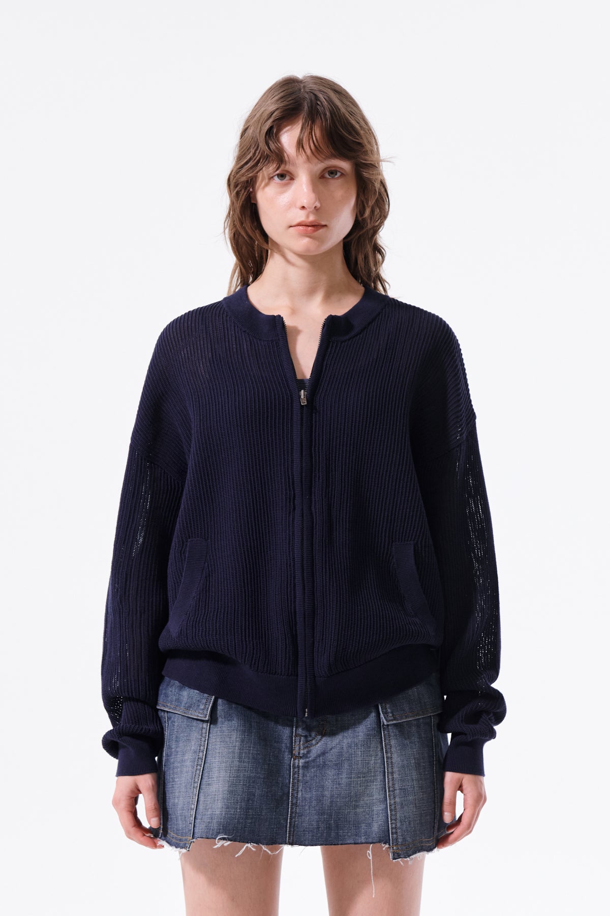 Áo len unisex với thiết kế thoáng khí, có túi trước và logo Matin Kim nổi bật.
