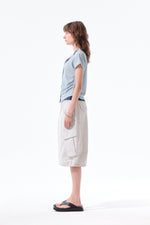 Áo blouse nữ cổ bẻ, tay ngắn, có nút, chi tiết nhún rút, màu xanh nhạt.