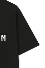 Áo top nữ với logo Matin Kim in nổi bật trên nền đen.