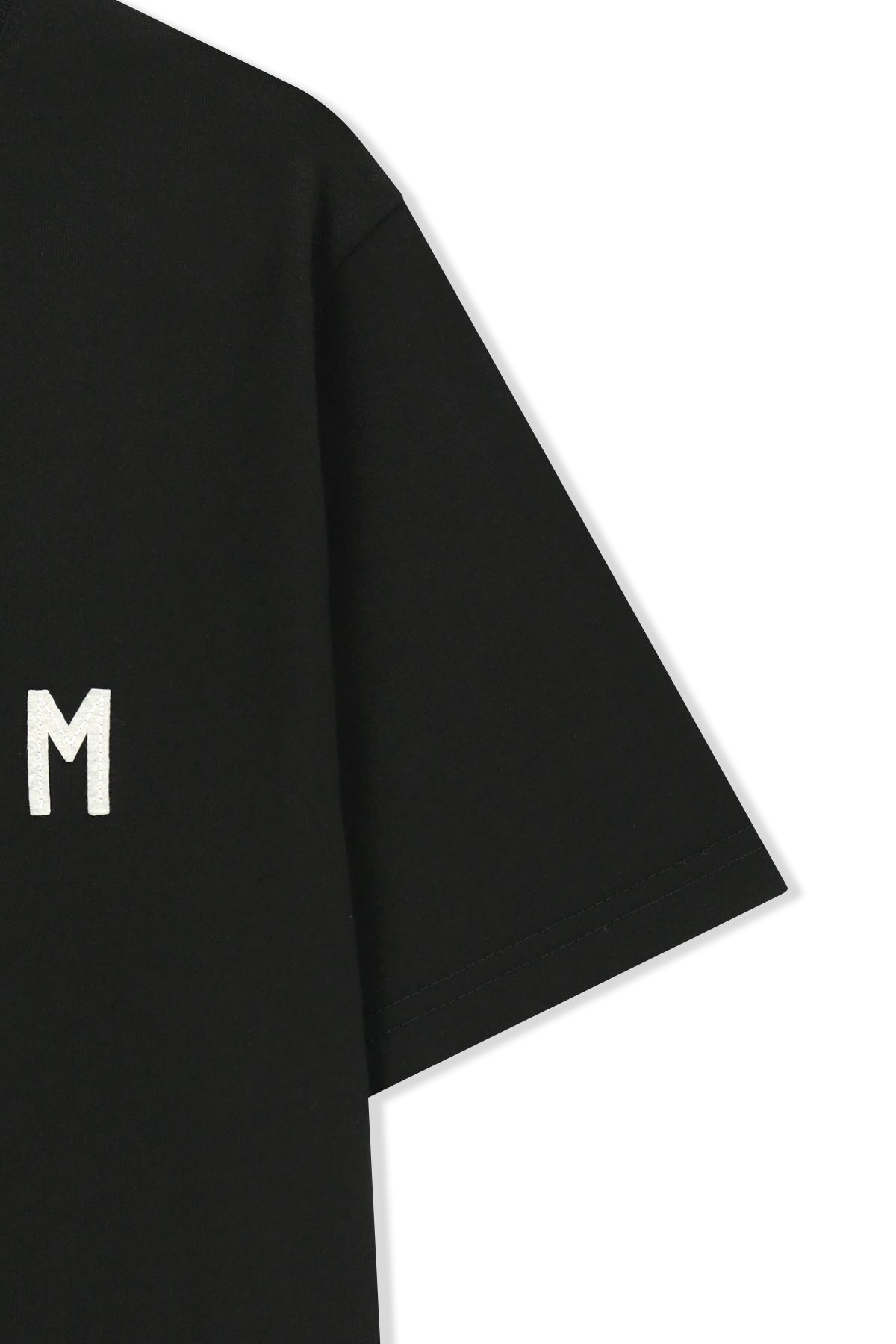 Áo top nữ với logo Matin Kim in nổi bật trên nền đen.