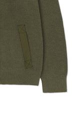 Áo sơ mi nam cotton màu khaki, tay dài, cổ tròn, có chữ ở lưng trên và hai túi hông.
