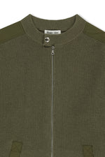 Áo sơ mi nam cotton màu khaki, tay dài, cổ tròn, có chữ ở lưng trên và hai túi hông.