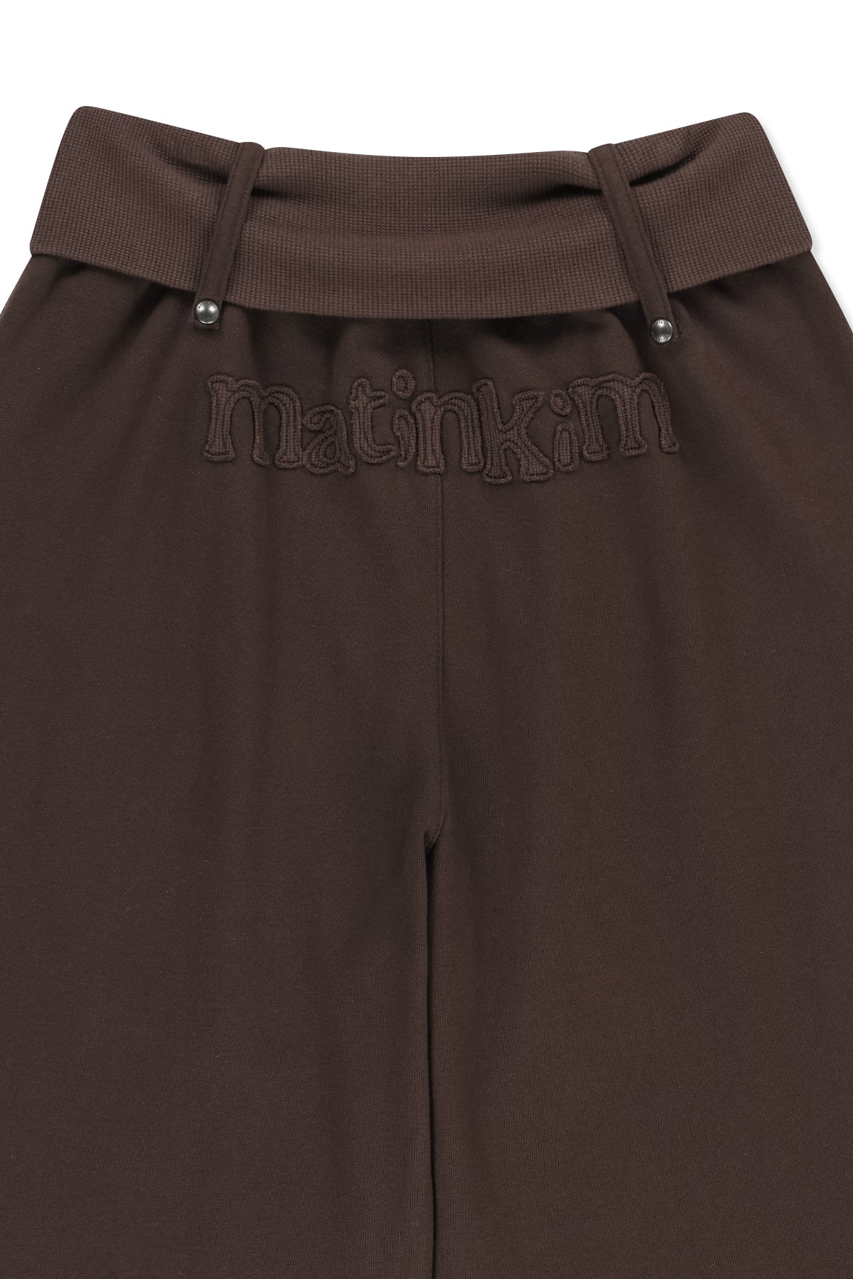 Quần ống rộng nữ với cạp viền dây rút, chất liệu vải jersey mềm mại, thiết kế thoải mái và hiện đại.