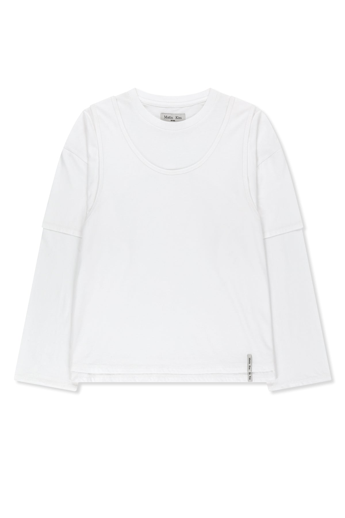 Áo blouse nữ cotton màu trắng, cổ tròn, tay dài, dáng regular dài đến hông, thiết kế khoét lưng.